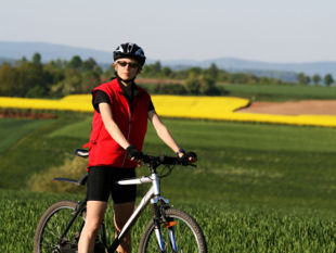 Biker by a field of Sunflowers.