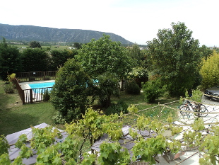Luberon Cycling Holidays, France - Ensuite Room Oppède - View over the pool to the Luberon hills.